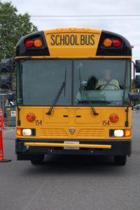 Bus and driver waiting to pick up students