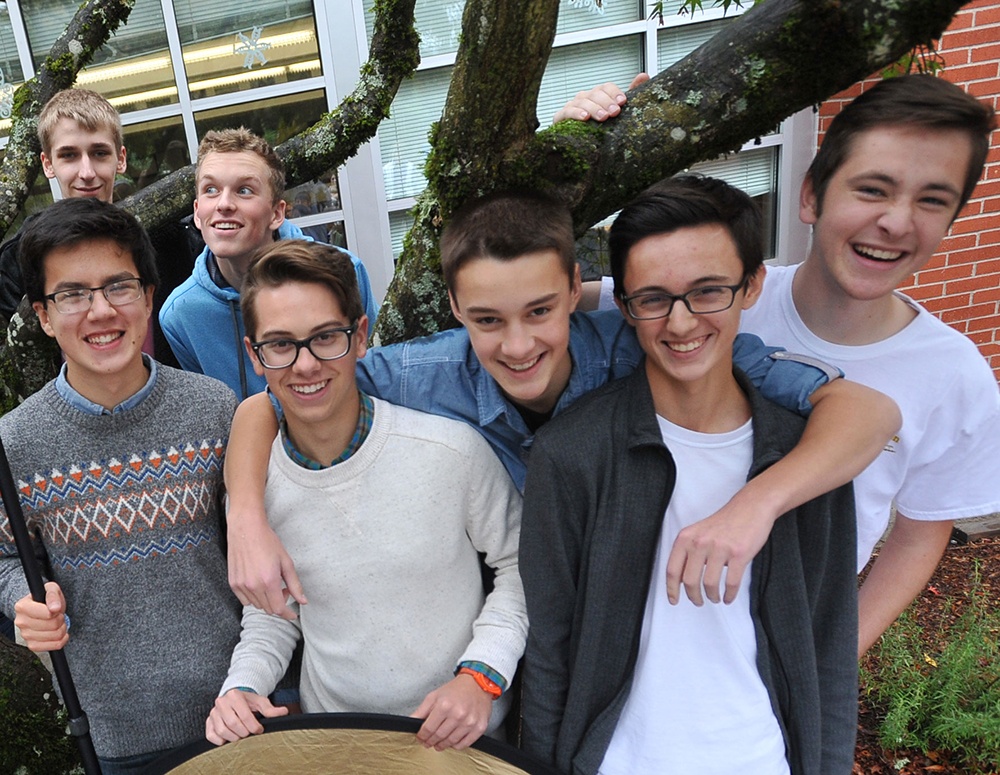 Students hanging out together in front of the school